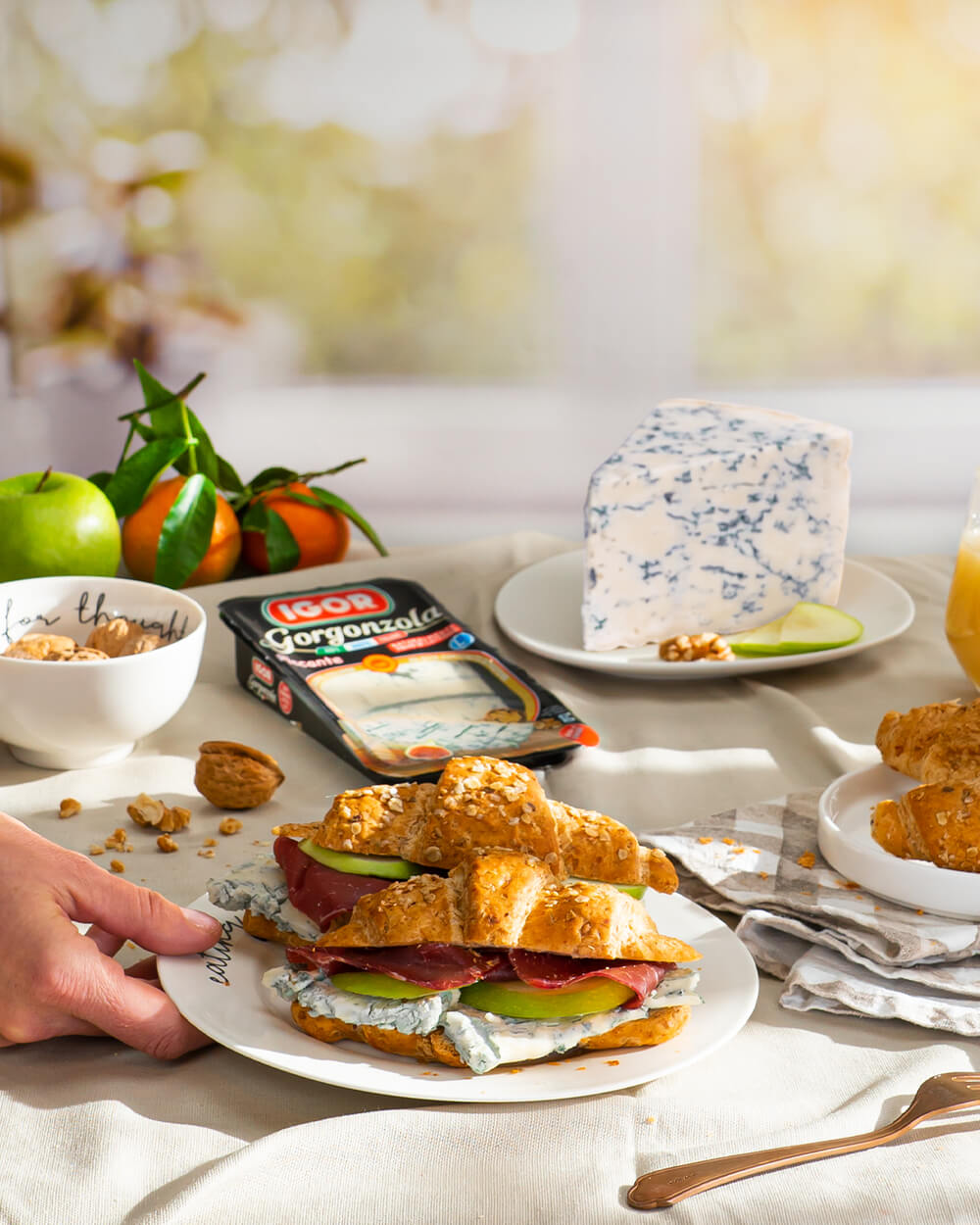 Savory croissants with raw ham, avocado and spicy Gorgonzola