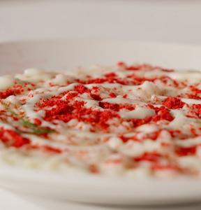 RISOTTO CON FONDUTA GORGONZOLA GRAN RISERVA LEONARDI, POLVERE DI LAMPONI E ANETO FRESCO